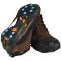nordic ice grip rubber snow grip with metal spikes for shoes shown worn on the shoes
